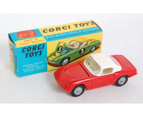 A Corgi Toys No. 319 Lotus Elan Coupe comprising red body with white roof and cream interior, with cast hubs, in the original