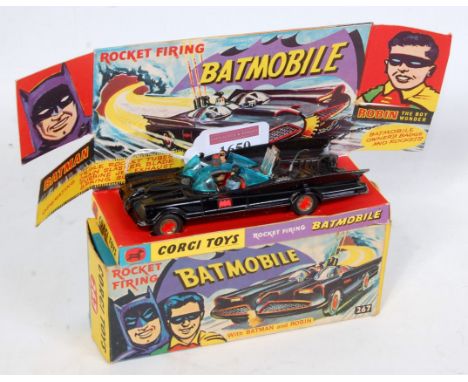 A Corgi Toys No. 267 Rocket Firing Batmobile, comprising gloss body with red interior and Batman & Robin figures, with Bat lo