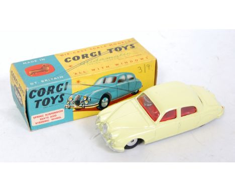 A Corgi Toys No. 208S Jaguar 2.4L saloon comprising of lemon yellow body with red interior and spun hubs, fitted with working