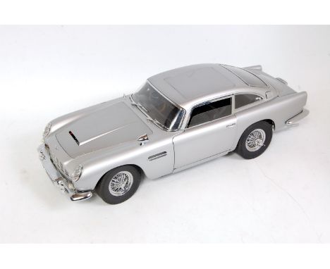 An Eagle Moss Cartwork detailed 1/18 scale model of James Bond's Aston Martin DB5 from Goldfinger, with original Aston Martin