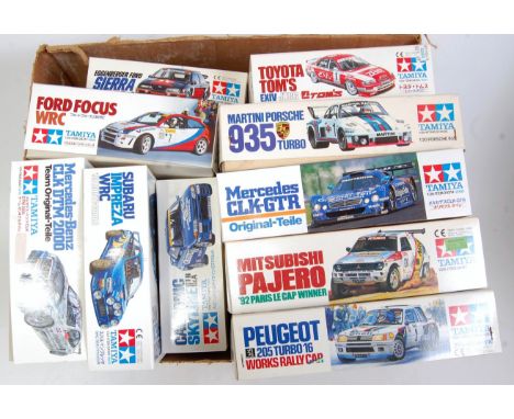 Ten various boxed Tamiya 1/24 scale mixed plastic racing car kits to include a Martini Porsche 935 Turbo, a Toyota Toms EXV J