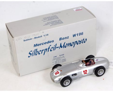 A CMC Exclusive Models 1/18 scale No. M-042 model of a Mercedes Benz W196 racing car comprising silver body with racing No.12