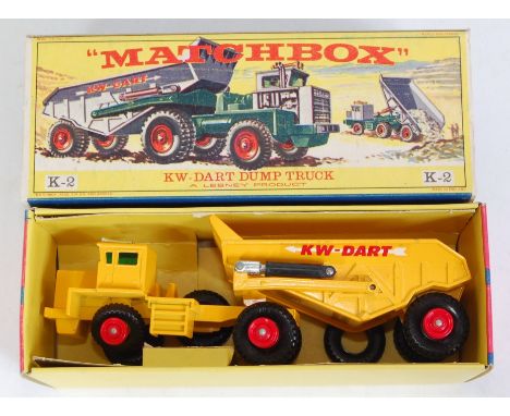 A Matchbox kingsize No. K-2 KW Dart Dump truck comprising yellow body with red hubs and KW-Dart livery, housed in the origina