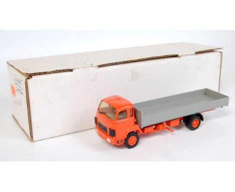 A white metal and resin kit built model of a Saurer 4-wheel flatbed lorry comprising orange chassis and matching hubs with gr