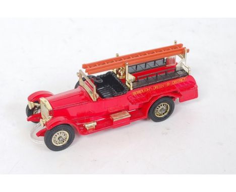 A Matchbox Models of Yesteryear Y7 1920 Rolls Royce fire engine comprising of bright red body with black interior and tan lad