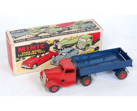 A Triang Minic No. 30M mechanical horse and Pantechnicon, comprising of red tractor unit with blue trailer and red hubs, hous