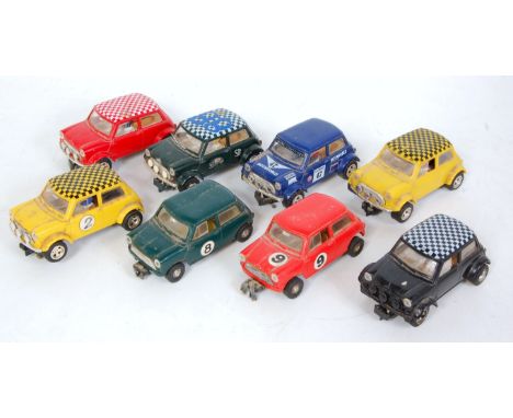 Eight loose Scalextric and Hornby Hobbies slot car racing Minis to include an SU Rally Monte Carlo No. 341 racing Mini, a Sca