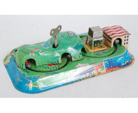 A tinplate toy group to include a Marx Toys tinplate clockwork tractor, 1950s example, finished in green and cream, together 