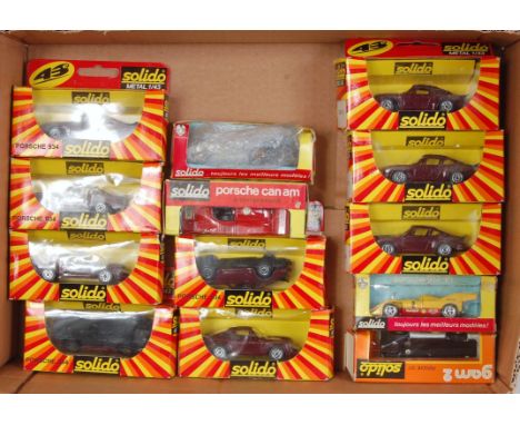 13 various window boxed Solido 1/43 scale racing and sports car diecasts to include a No. 18 Porsche Can-Am, a Porsche 917, t