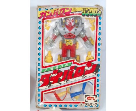 A Bullmark Japanese model of a transformer style robot, appears complete, in the original window box, box with some storage d