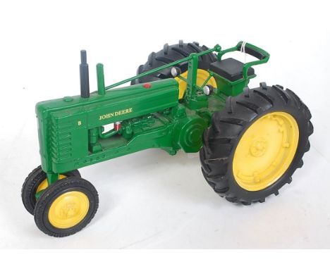 A Danbury Mint static model of a 1948 John Deere model B tractor clock, missing steering wheel