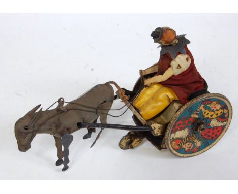 A circa 1910 Lehmann tinplate and clockwork model and Balky donkey, comprising two wheeled cart pulled by a grey donkey with 