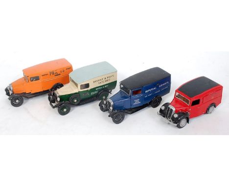 Four white metal hand built commercial delivery vans to include a K&amp;R Replicas Royal Mail Morris 10cwt delivery van, a Me