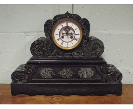 Large French striking mantle clock in green fleck and black marble case, 17'5" tall, 23.5" wide