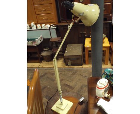A cream angle poise desk lamp 