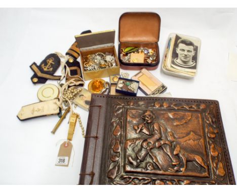 A collection of costume jewellery, cigarette lighters, powder compact together with a few picture postcards and a leather pho