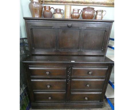 Dark Ercol cabinet with six drawers under and drop down front 