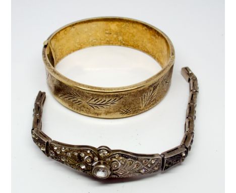 A hallmarked silver hinged ladies bangle and a paste set bracelet 