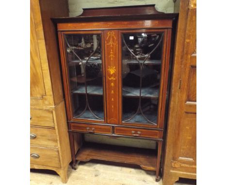 Edwardian inlaid mahogany two door glazed china display cabinet fitted two drawers with shelf under, 3'6" wide 