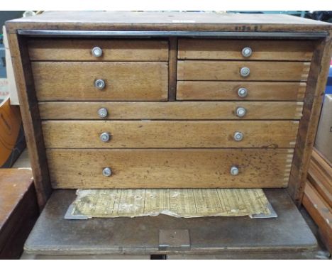 Multi drawer cabinet with drop down front and some tools 