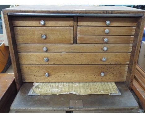 Multi drawer cabinet with drop down front and some tools 