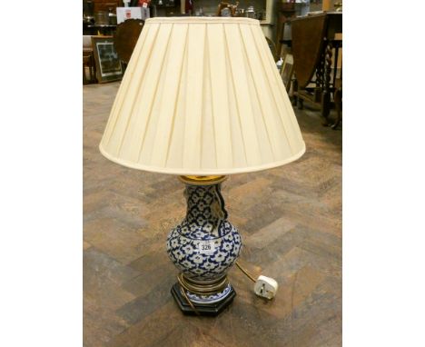 A Chinese style blue and white table lamp with shade 