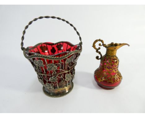 Ruby and gilt metal overlaid bottle and a ruby glass sugar basket in silver plated mount 