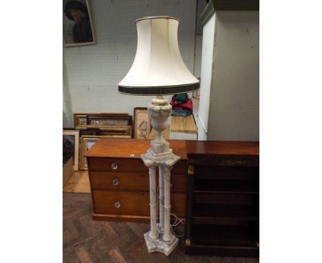 A large urn shaped white grained marble table lamp with cream shade 