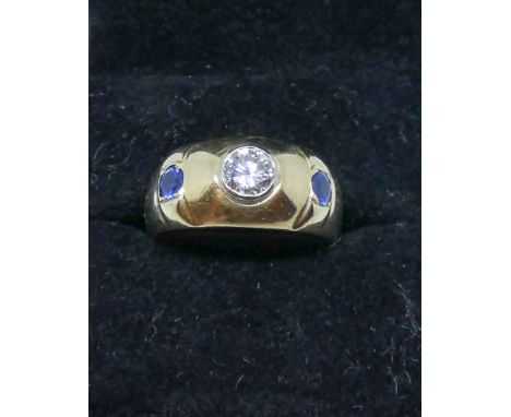 Gents sapphire and diamond three stone ring, on 18ct yellow gold band, centre diamond weighs 0.5 carat, gross weight 5.5 gram