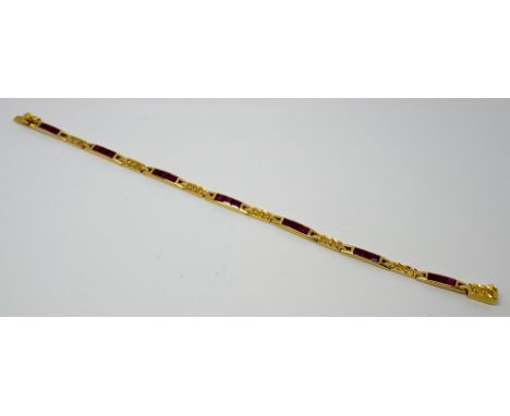 18ct yellow gold ruby lime bracelet set with princess cut rubies interspersed with diamond set links. Gross weight 11.7g, box