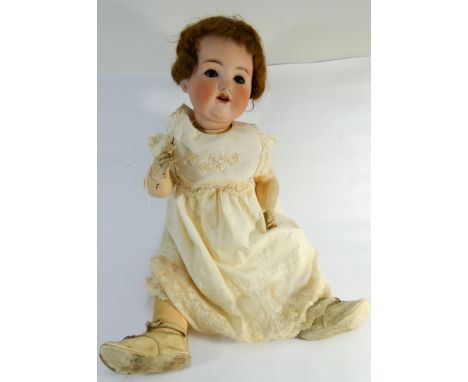 Armand Marseille German bisque head doll, numbered on back 990A12M. Bisque head composition body. Approx 60cm tall.   Head ap