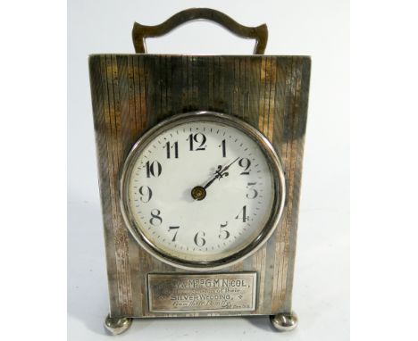 A early 20th century silver carriage clock, silver cased hallmark 1910, height including handle 15cms with inscription to fro