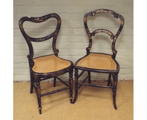 Two Victorian black lacquered gilt and mother of pearl decorated bedroom chairs with cane seats 