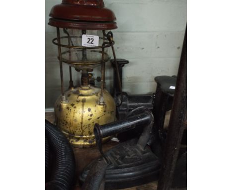 An old tilley lamp, flat irons, shoe lasts, bellows etc 