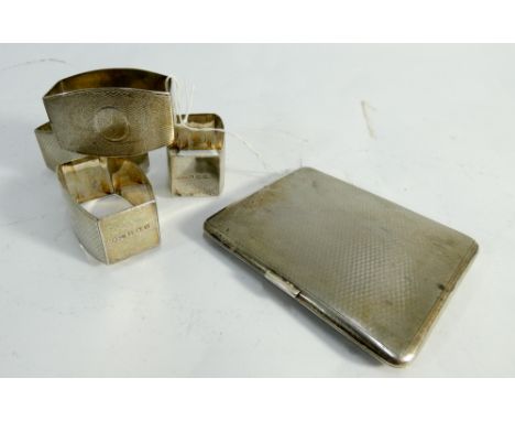 Set of four hallmarked silver engine turned napkin rings, un engraved, and an engine turned cigarette case, gross weight of l