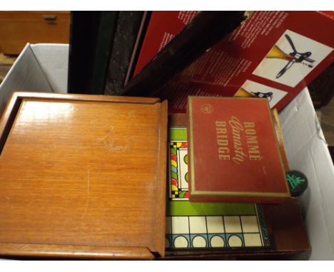 A large quantity of assorted vintage games, lever action corkscrew etc
