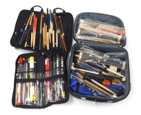 Large collection of drum sticks and brushes, percussion mallets etc. (some new in packaging), within two stick bags and a whe