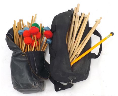 A collection of mallets and beaters etc. within two stick bags