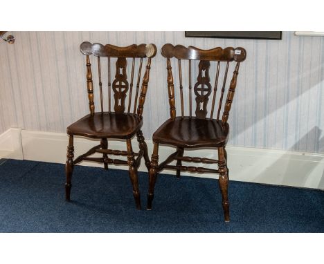 Two Antique Rustic Elm Kitchen Chairs in traditional spindle back design with central decorative panel.  Well turned spindle 