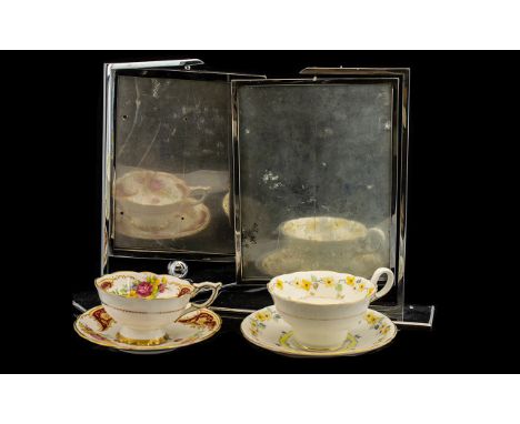 Two Decorative Bone China Cups &amp; Saucers one by Royal Stafford in white ground with border of yellow flowers and gold rim
