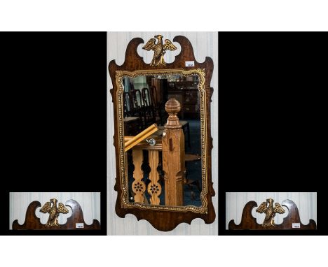Antique Chippendale Mirror - in mahogany and gilt wood with a large winged eagle finial captured in flight. The mirror is def
