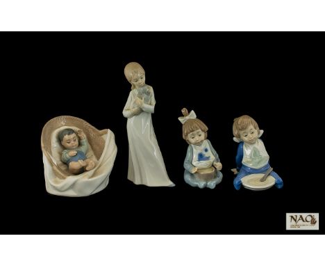 Nao by Lladro Figures ( 4 ) Four In Total. Comprises 1/ Little Baby Boy, Sleeping In a Large Basket. 4 Inches - 10 cm High. 2