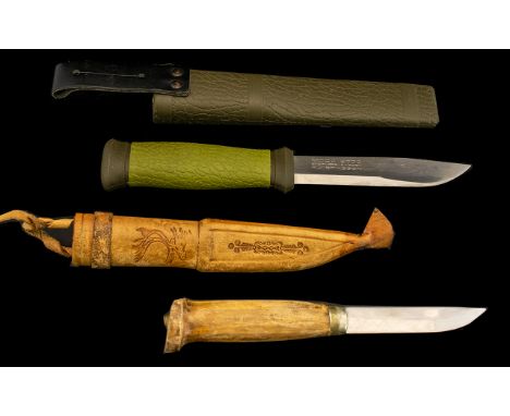 Two Hunting Knives.  One handmade Swedish knife, and one Swedish Mora 2000.  Very sharp knives, both in sheaths.  See photogr