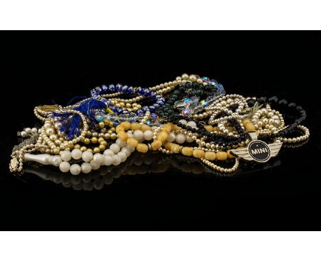 A Mixed Collection Of Costume Jewellery To include several strand of faux pearls, beads, glass beads, enamel pin etc. Please 