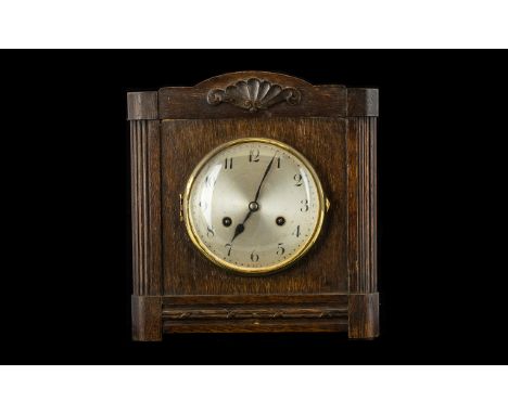 Art Deco Oak Cased Mantle Clock. Of square form. with silvered dial and Arabic Numerals. Complete with key and pendulum and m