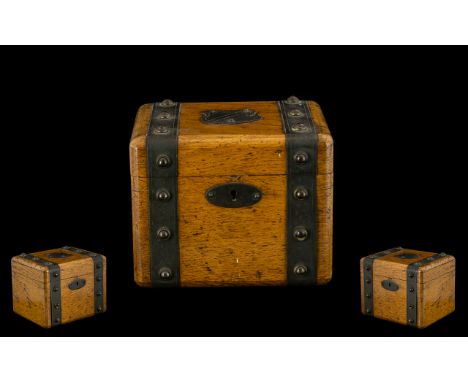 Oak Tea Caddy with metal banding with studs, shield top.  Early 20th century.  See images.