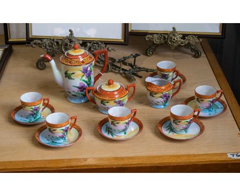 An Oriental Tea Set comprising Tea Pot, Lidded Twin-Handled Sugar Bowl, Milk Jug and Six Cups &amp; Saucers. Japanese set in 