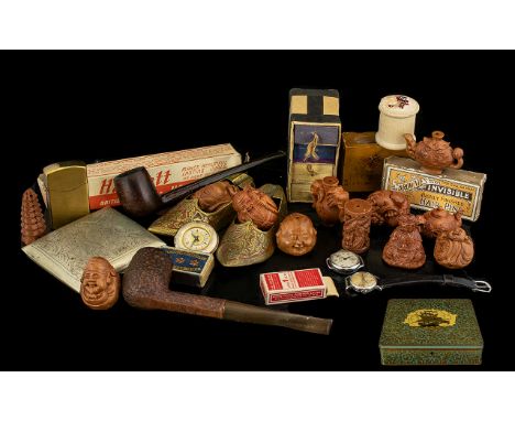 Tin of Collectibles to include 12 Netsuke figures depicting various Oriental gentlemen, and teapots etc. Also, two wooden pip