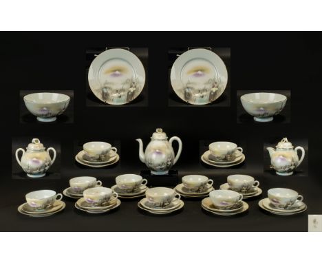 Japanese Porcelain Tea Set marked to base, comprising a coffee pot;  12 trios of cups, saucers and cake/sandwich plates; a tw