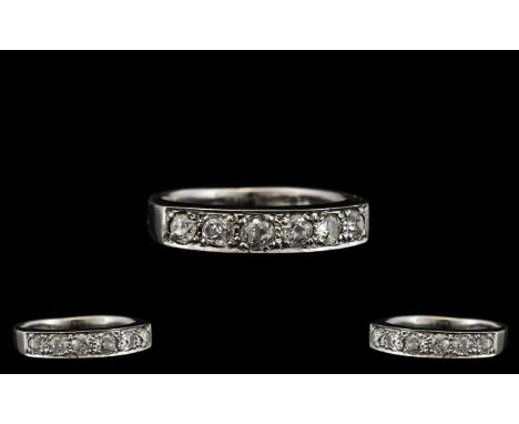 18ct White Gold - Quality and Pleasing Seven Stone Diamond Ring. Fully Hallmarked for 18ct - 750. The Seven old Brilliant Cut